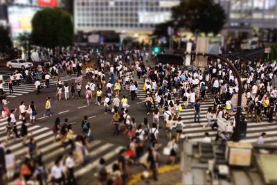 High angle view of people walking on road