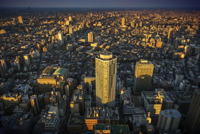 High angle view of city lit up