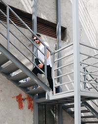 High angle view of woman on stairs