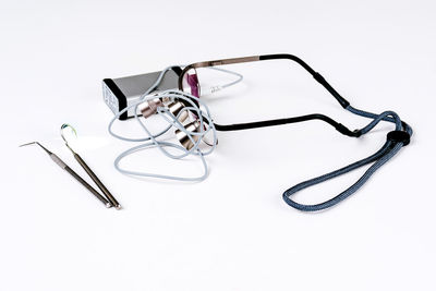 High angle view of eyeglasses against white background