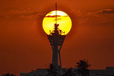 Silhouette of city at sunset