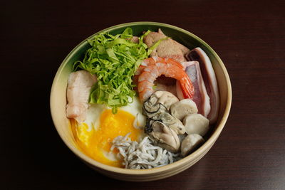 High angle view of chopped vegetables in bowl on table
