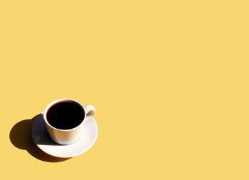 High angle view of coffee cup on table