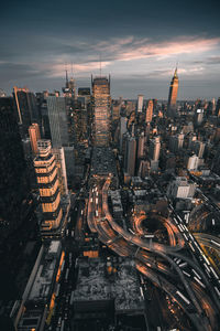 High angle view of city lit up at night