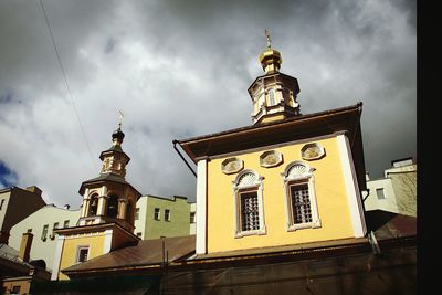 Low angle view of clock tower against sky