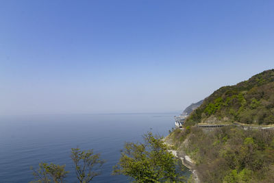 Scenic view of sea against clear blue sky