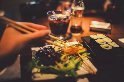 Cropped image of person having dinner