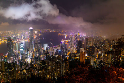 High angle view of illuminated city buildings at night