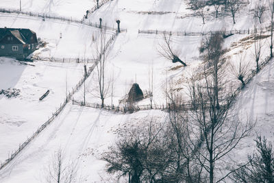 Ski lift on snow covered landscape