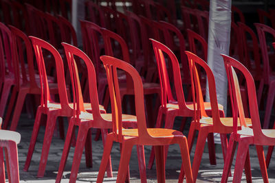 Empty chairs at illuminated restaurant