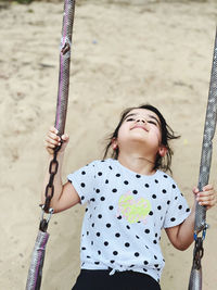  swinging at playground. free sprited 