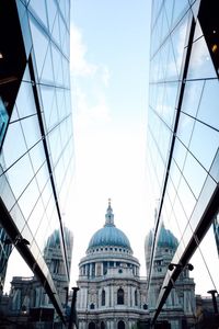 Low angle view of buildings in city against sky