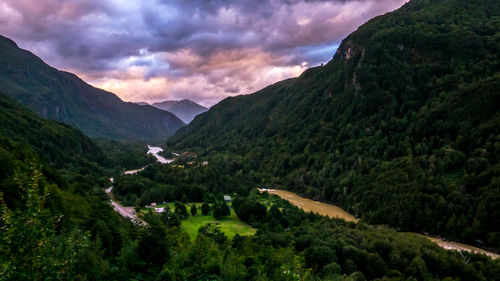 Scenic view of mountains against cloudy sky