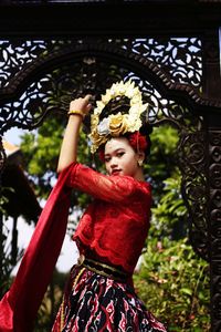 Portrait of smiling girl standing outdoors