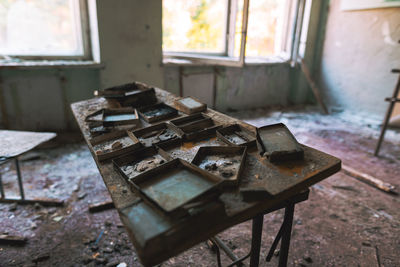 High angle view of old abandoned school table