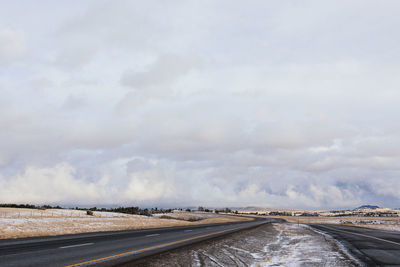 Cloudy sky above road