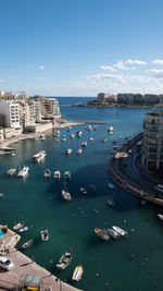 High angle view of boats in city