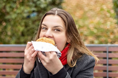 Portrait of woman eating food