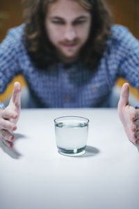 Telekinesis. practicing telekinetic powers with glass of water