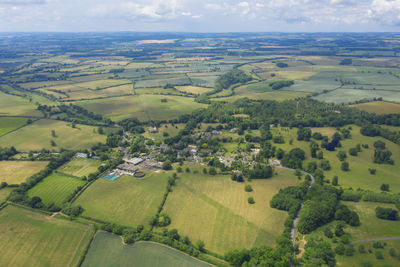 Aerial view of agricultural field against sky