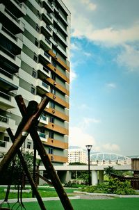 View of buildings against cloudy sky