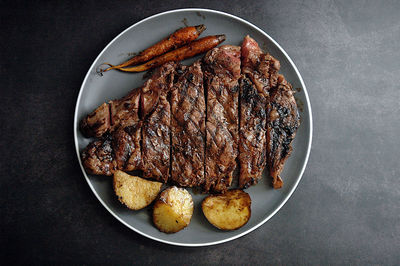 High angle view of steak served on table