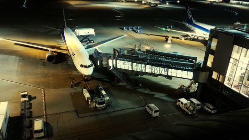 High angle view of illuminated airplane at night