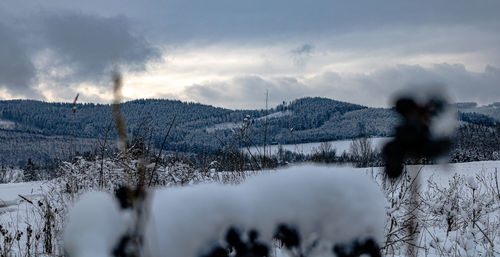 Scenic view of mountains against sky during winter