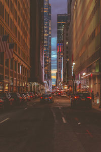 Illuminated city street at night