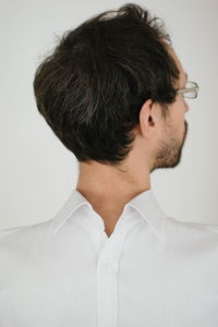 Man wearing shirt against white background