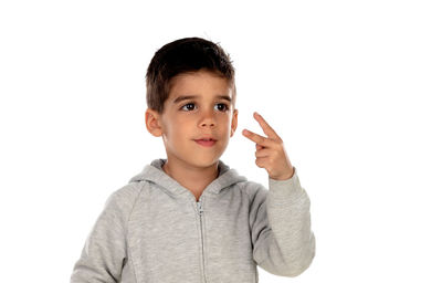 Portrait of cute boy against white background