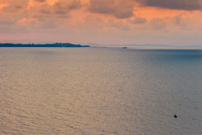 Scenic view of sea against sky at sunset