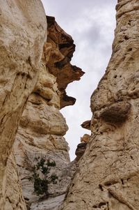 Low angle view of rock formation against sky