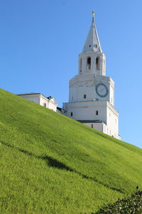 View of bell tower against clear blue sky