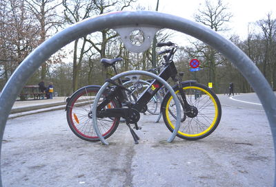 Bicycle parked on snow covered street