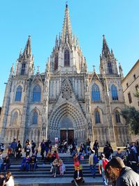 People in front of historic church 