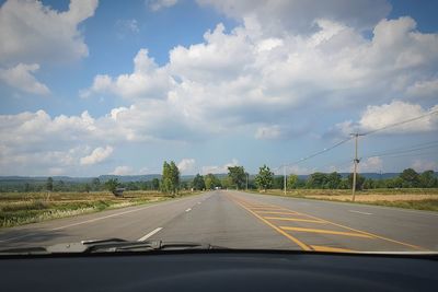 Road seen through car windshield