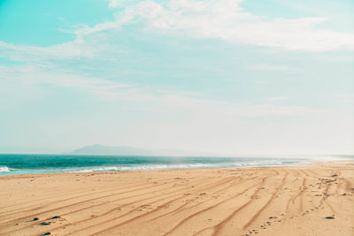 Scenic view of beach against sky