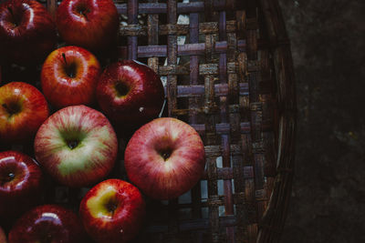 High angle view of apples in basket on table