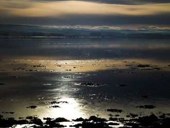 Scenic view of sea against sky at sunset