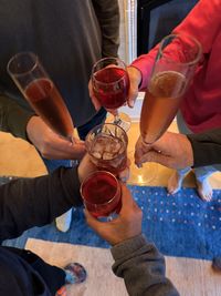 Cropped hand of man holding bottle