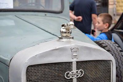 Rear view of boys on car