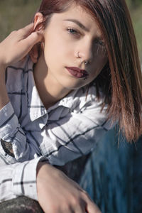 Portrait of beautiful woman with redhead