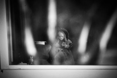 Young woman with reflection in mirror