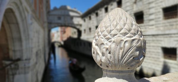 Close-up of sculpture against building