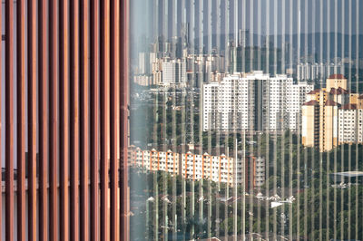 Reflection of buildings on glass window