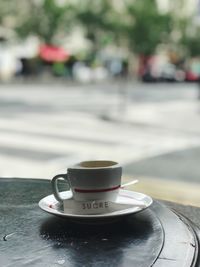 Close-up of coffee cup on table
