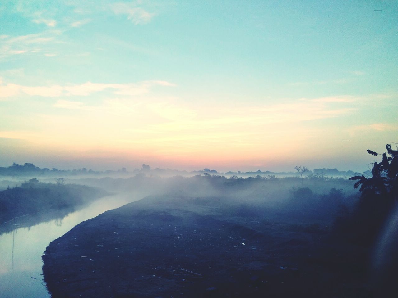 scenics, water, sky, beauty in nature, sunset, sea, tranquil scene, cloud - sky, nature, tranquility, horizon over water, idyllic, landscape, travel, motion, aerial view, weather, outdoors, fog, cloud