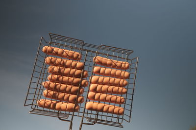 Low angle view of barbecue grill against sky