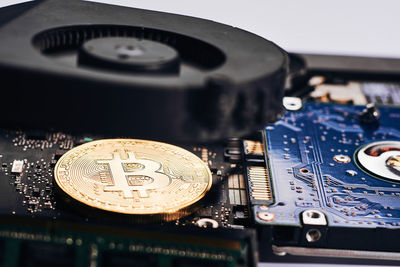 Close-up of bitcoin with computer equipment